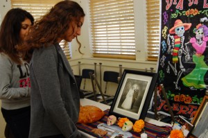 Sophomores Caroline Maroutian and Jennifer Sahakian view the community altar set up for the 5th annual Day of the Dead. Classes set up altars to honor leaders such as President John F. Kennedy Jr., mathematicians such as Sir Isaac Newton and journalists such as Daniel Pearl. Photo by Elizabeth Hovanesian 