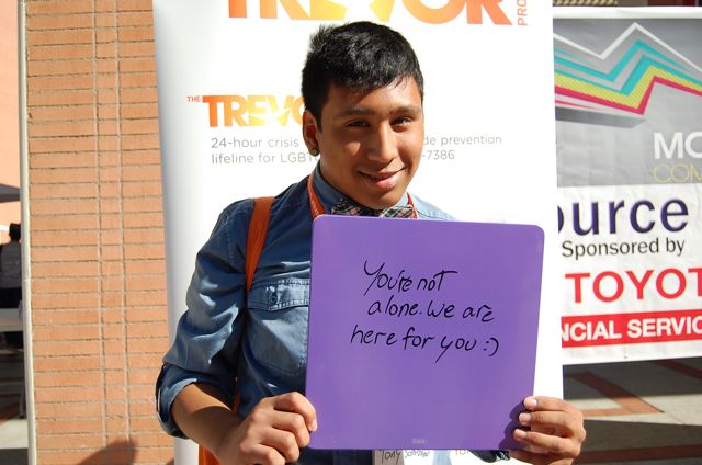 Senior Anthony Solorzano writes a message to all lesbian, gay, bisexual, transgender and questioning (LGBTQ)  youth at the Models of Pride conference on Oct. 19. Members of Daniel Pearl Magnet High's Gay Straight Alliance attended the workshops at USC, which was followed by a dance to support the LGBTQ community. Photo by MyGemLee Guzman.