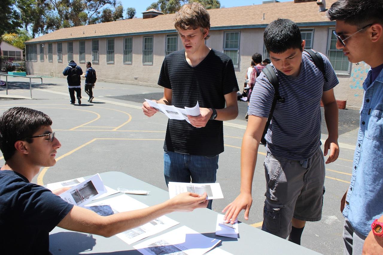 Thursday marked the 99th anniversary of the Armenia genocide at the hands of Turkey. During lunch, junior Alex Zakarian handed out information about the Armenian genocide to students, including seniors Harry Fanthorpe, Rafael Rodriguez and Robert Tapia. Photo by Alexandra Torres