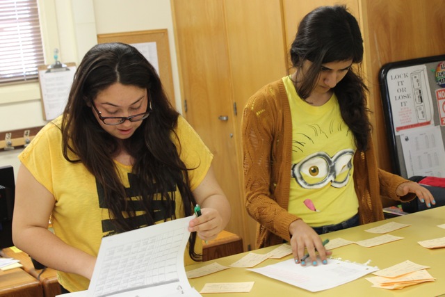  Daniel Pearl student wear yellow in support of Suicide Awareness Day as they work in the main office. Photo by Jordan Timsit