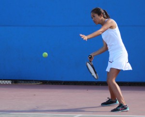 Senior Elyssa Gorospe lines up a shot during a Birmingham Community Charter High School Tennis practice. Photo by Jake Dobbs