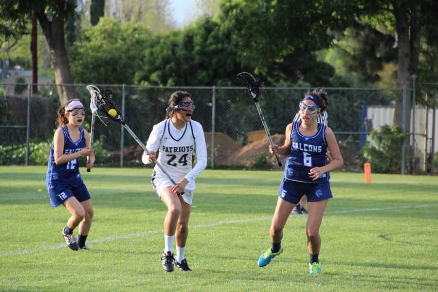 Defender Maria Ruiz out runs the two players from Crescenta Valley High School during a match on April 6. The Patriots won 11-10. 