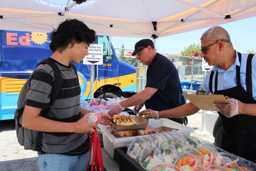 Senior Daniel Hernandez chooses his meal from the LAUSD food truck that visited campus on May 30. Students and faculty were able to choose from a taco, burrito, salad or nachos with the option of fruit on the side.