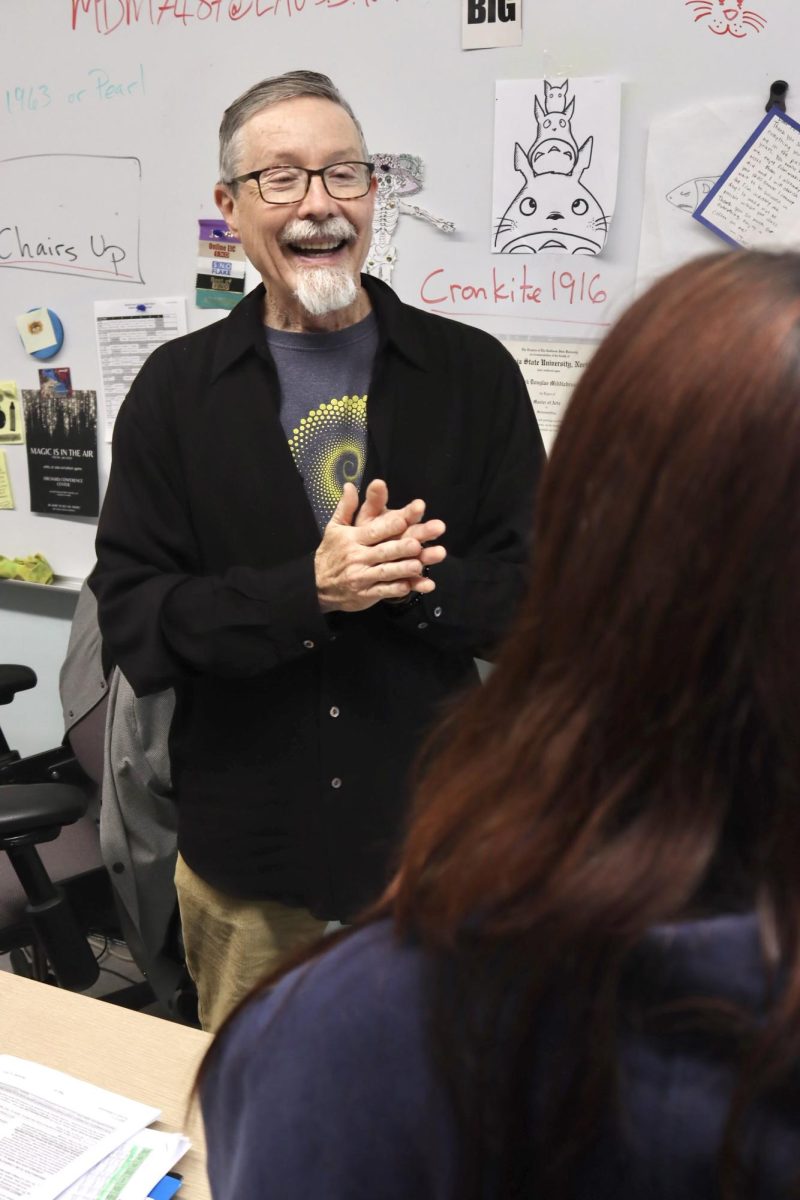 Video production teacher Mark Middlebrook, who will be retiring at the end of the school year, talks to senior Sara Gomez during period 5 on May 22.
