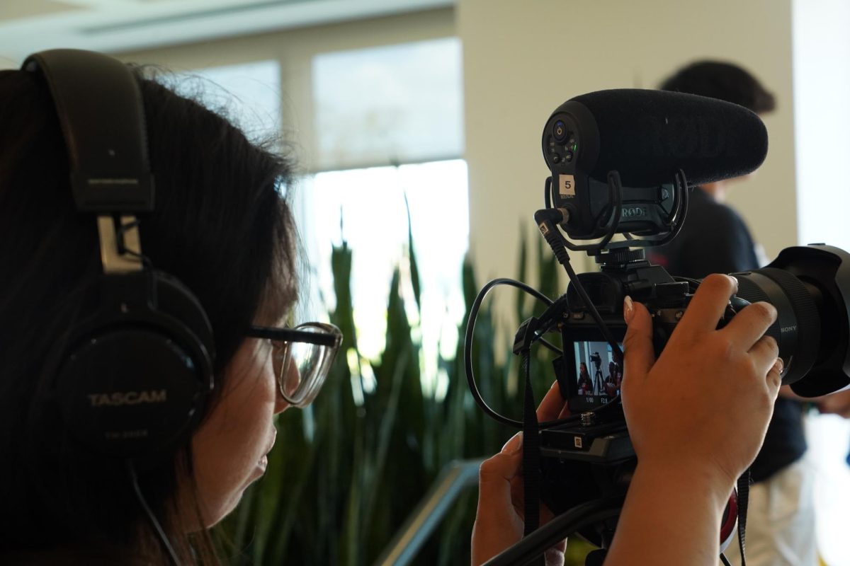 Junior Jenny Marquez films B-roll to practice her video journalism skills during SRL's Summer Academy on June 20.