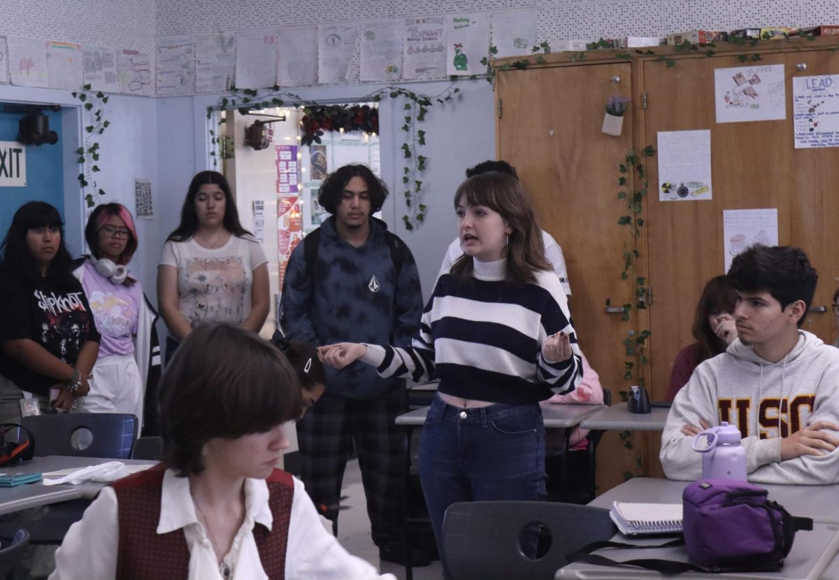 Students gathered to spread awareness about the teacher displacement during lunch on Sept. 20. Students gave out armbands and wore them to silently protest the displaced positions.