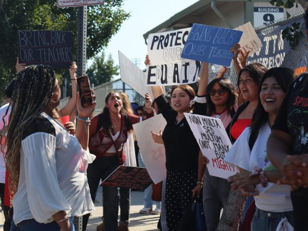 Students protest for the reinstatement of both music teacher Wes Hambright and Spanish teacher Glenda Hurtado on Sept. 23. Hambright was reinstated that day, but students called for the return of both teachers.