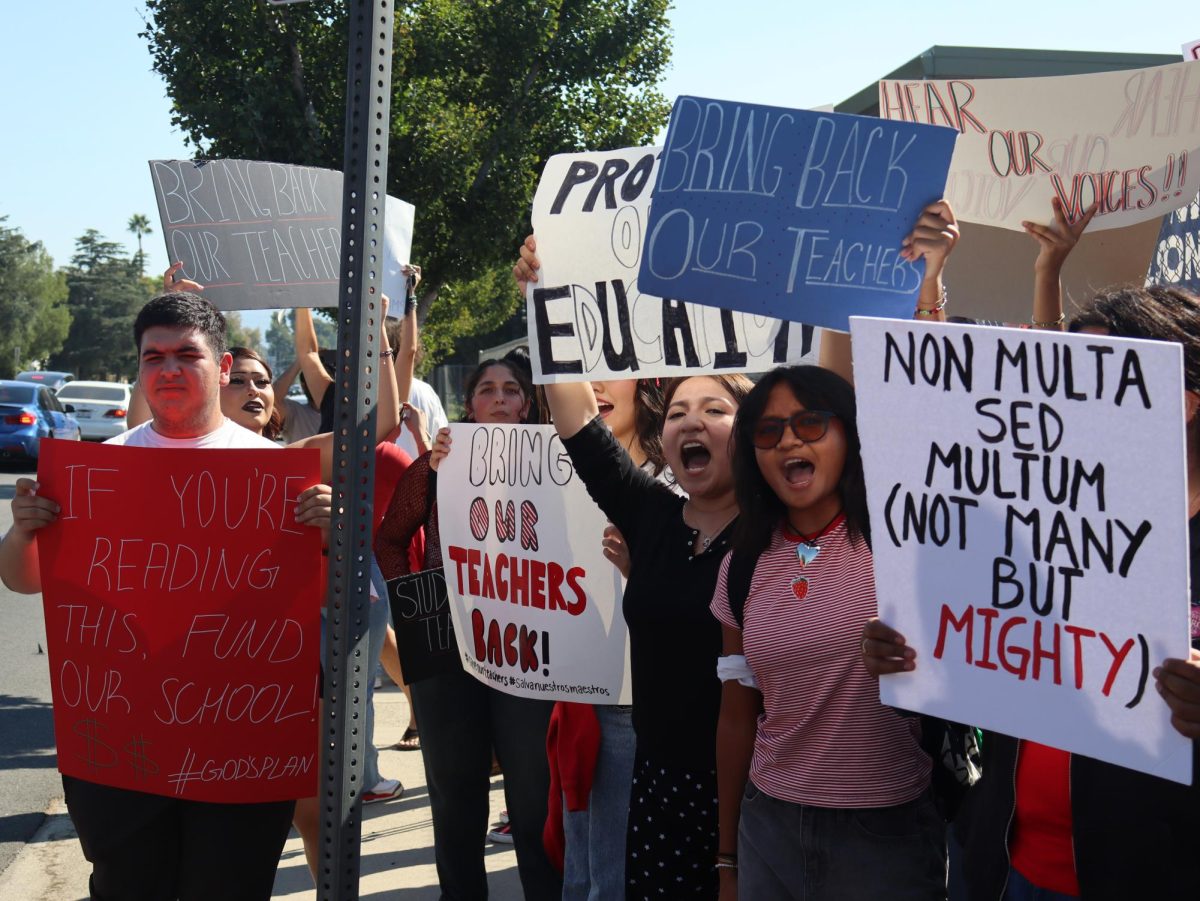 Senior Vannesa Gonzalez and juniors Abraam Grigorian and Kaleigh Tapaoan protest during a school-wide walkout for the reinstatement of Spanish teacher Glenda Hurtado and music teacher Wes Hambright held on Sept 23. Although Hambright's position was restored, students are still advocating for both teachers' return. 