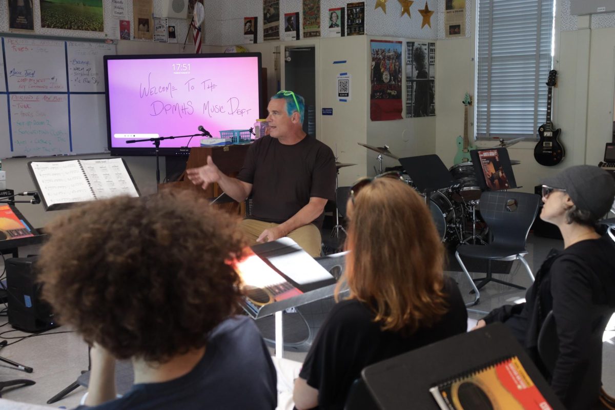 Former music teacher Wes Hambright tells the parents of his period 2 Keyboarding and Music Tech class about their daily activites on Aug. 27. Hambright was one of the two teachers displaced. 