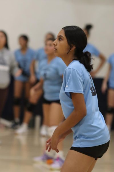 Freshman Cecia Herrera analyzes the volleyball court on Sept. 18. Although she played volleyball before high school, Herrera is excited for her first season at Birmingham Charter Community High School.