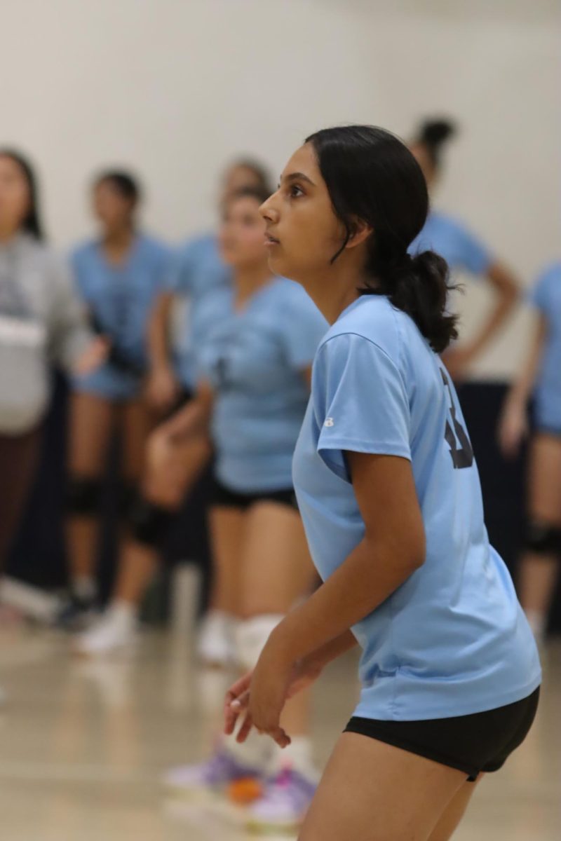 Freshman Cecia Herrera analyzes the volleyball court on Sept. 18. Although she played volleyball before high school, Herrera is excited for her first season at Birmingham Charter Community High School.