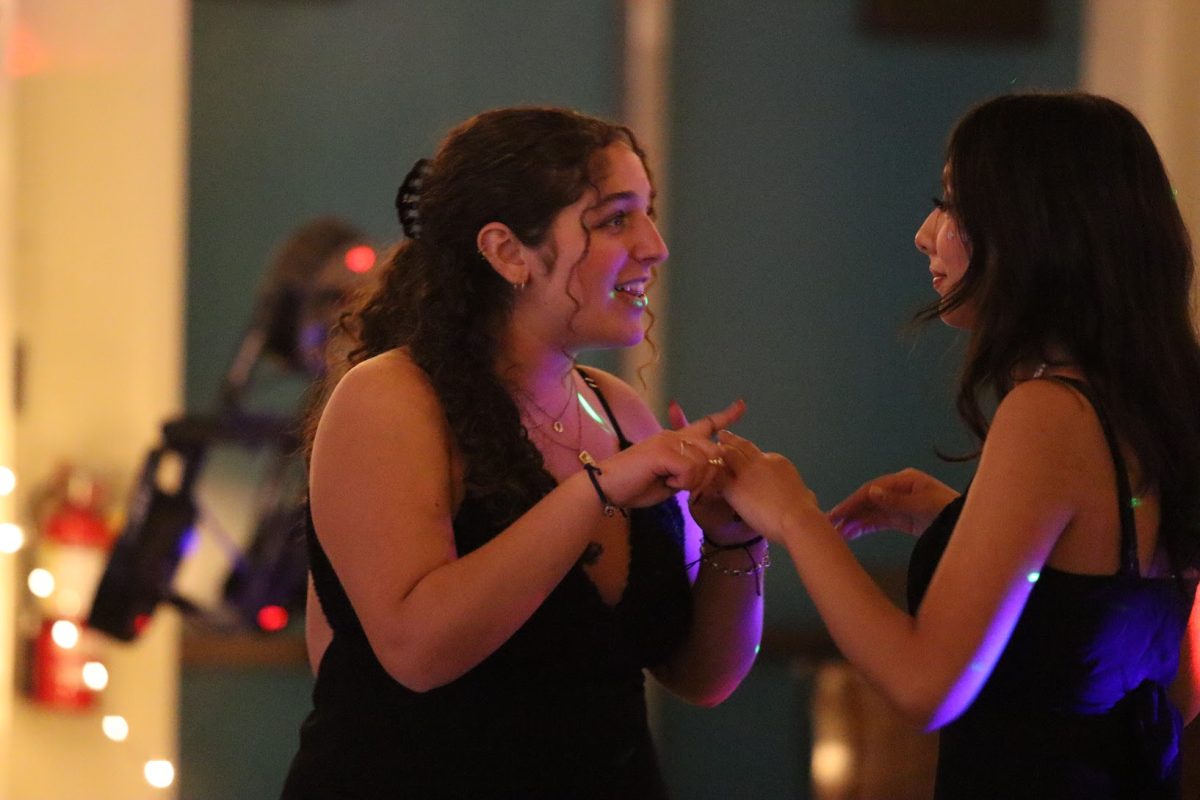 Senior Leeron Nakash and guest Alia Galvan dance together during the homecoming dance on Oct. 18.