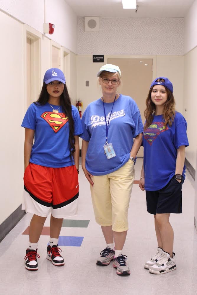 Junior Guadalupe Martinez, climate advocate Magaly Ruiz and junior Julia Garcia dress up in their Adam Sandler-inspired outfits for Adam Sandler Day on Oct. 8.