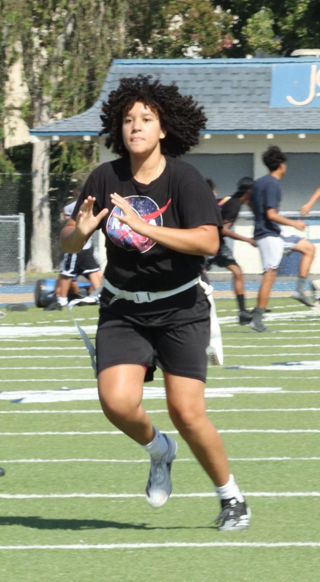 Sophomore Andrea Arosemena prepares to catch the ball on Sept. 18.  The varsity girls flag football team were getting ready for their game later in the week. "Flag football is fun, it's exciting because it is new, I really enjoy it," Arosemena said.