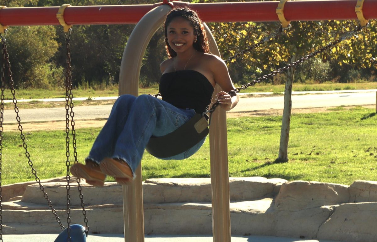 Senior Angela Mendoza swings on a swing at Lake Balboa Park during the Senior Picnic on Oct. 8. 