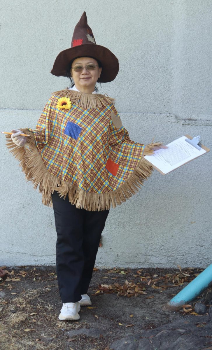 Cafeteria Manager Arlene Gamboa dresses as a scarecrow for Halloween on Oct. 31.