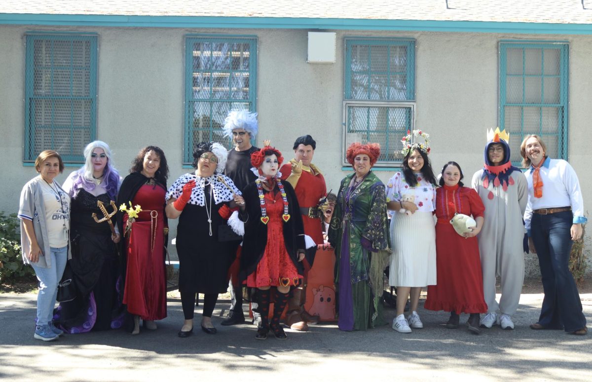 Daniel Pearl Magnet High School teachers and staff all show off and display their costumes during lunch on Oct. 31.