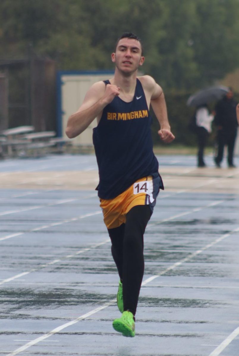 Senior Deven Szymczak runs to complete his 1600-meter, setting a new personal record on Mar. 14. The track & field meet was held at Birmingham Community Charter High School, competing against James Monroe High School, Canoga Park High School and Sherman Oaks Center for Enriched Studies.