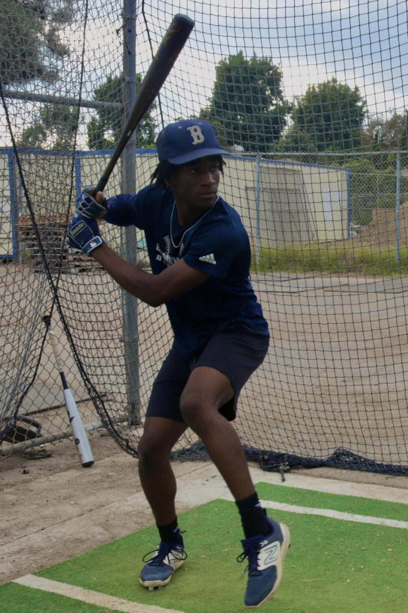 Senior Zion Waddell, a middle infielder for Birmingham Community Charter High School's varsity baseball team, practices his batting technique in the cage during after-school practice on Oct. 17.
