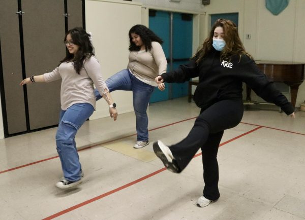 Coach Andrea Rodriguez (far right) leads a dance class for the Keep Youth Doing Something (KYDS) after school program on Nov. 19. Juniors Ariana Lopez Villacorta and Nemesi Martinez Morales enjoy participating in the program’s dance program and use this opportunity to reside in a safe space after school hours.