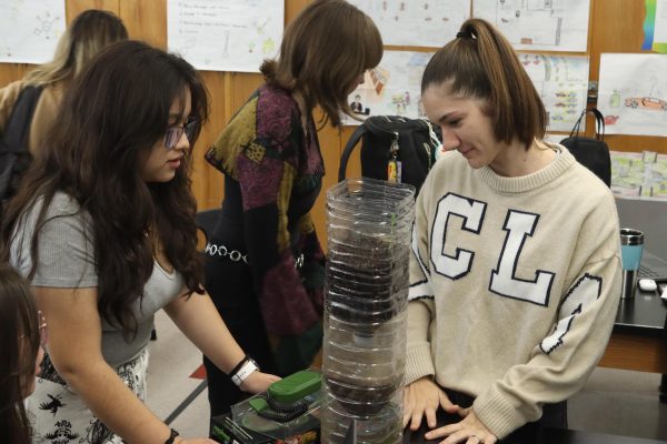 Junior Ariana Lopez-Villacorta recieves assistance from science teacher Ani Zohrabyan during her period 2 AP Environmental Science Class on Oct 28. In the class, students were tasked with building and maintaining miniature ecosystems within a plastic bottle column in order to study how they function.