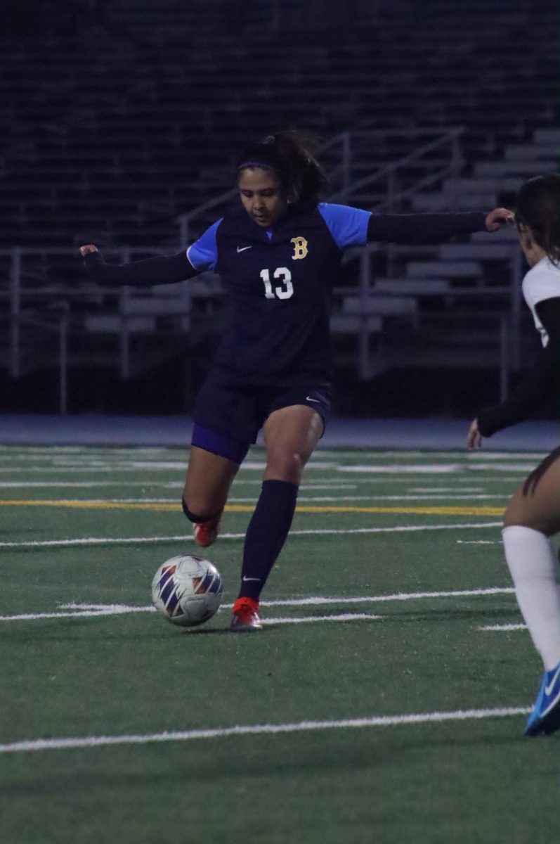 Junior Marianna Alvarez kick a long pass to her teammate during the last game of
the season on Feb. 7. The game ended with a score of 2 to 1 with the Birmingham Community Charter High School junior varsity girls soccer team defeating Cleveland High School’s team to end the season off with a hard fought victory.