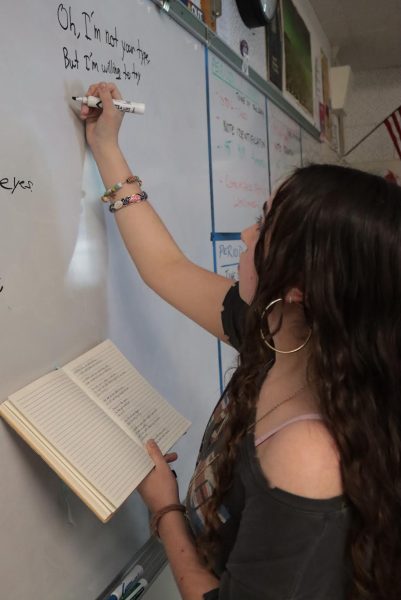 Sophomore Desirae Carns reviews song lyrics for her untitled original song during
Songwriting Club on Jan. 22. The club will perform the song along with some
original beats and melodies for the upcoming Spring Concert.