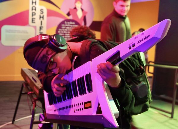 Sophomore Giancarlo Valdez plays the keytar at the GRAMMY Museum's "Sonic Playground" on April 3. Students from AP African American Studies and music department went on a field trip to the GRAMMY Museum to learn about music and GRAMMY’S history.